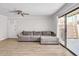 Light filled living room featuring sliding glass doors and gray sofa at 3500 N Hayden Rd # 203, Scottsdale, AZ 85251