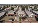 Expansive aerial view of a suburban neighborhood with well-maintained houses and desert landscaping at 3810 N 106Th Dr, Avondale, AZ 85392