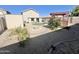 The backyard features gravel landscaping, a pergola and a small patch of artificial turf at 3810 N 106Th Dr, Avondale, AZ 85392