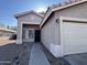 Front entrance with security door and a 1-car garage at 3810 N 106Th Dr, Avondale, AZ 85392