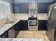 Well-appointed kitchen featuring modern appliances and granite countertops at 3810 N 106Th Dr, Avondale, AZ 85392