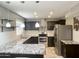 Beautiful kitchen with granite countertops, stainless steel appliances, and custom backsplash at 3810 N 106Th Dr, Avondale, AZ 85392