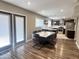 Open-concept kitchen with dark cabinetry, stainless appliances, and center island with seating at 3810 N 106Th Dr, Avondale, AZ 85392