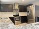 Updated kitchen with stainless steel appliances and beautiful granite countertops at 3810 N 106Th Dr, Avondale, AZ 85392