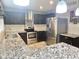 Fully equipped kitchen with stainless steel appliances, granite counters and ample cabinet space at 3810 N 106Th Dr, Avondale, AZ 85392