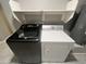Laundry room featuring a newer washer and dryer set and storage shelf at 3810 N 106Th Dr, Avondale, AZ 85392