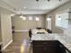 Spacious dining room features modern lighting and open views of the living area at 3810 N 106Th Dr, Avondale, AZ 85392