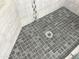 This is a shower floor, showcasing its modern tile design and drain in the bathroom, ideal for a quick rinse at 3810 N 106Th Dr, Avondale, AZ 85392