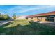 Spacious backyard with lush green grass and a charming patio area, perfect for outdoor entertaining at 3844 E Shomi St, Phoenix, AZ 85044
