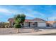 Charming single-story home featuring a red tile roof, xeriscape landscaping, and a two-car garage at 3844 E Shomi St, Phoenix, AZ 85044
