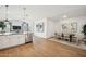 Open-concept kitchen with stainless steel appliances, connects seamlessly to the dining area and living space at 42400 W Peters Dr, Maricopa, AZ 85138