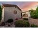 Backyard featuring lush greenery, stone features, and a charming outdoor entertaining space at 4637 E Narrowleaf Dr, Gilbert, AZ 85298