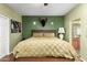 Warm and inviting bedroom with a wooden headboard and neutral bedding at 4637 E Narrowleaf Dr, Gilbert, AZ 85298