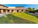 Beautifully landscaped exterior with a large lawn and patio seating at 4637 E Narrowleaf Dr, Gilbert, AZ 85298