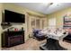 Entertaining game room featuring a foosball table, fireplace, and custom decor at 4637 E Narrowleaf Dr, Gilbert, AZ 85298