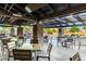Inviting outdoor dining area with stone columns, providing a comfortable space for residents to enjoy meals at 4637 E Narrowleaf Dr, Gilbert, AZ 85298