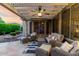 Inviting outdoor patio with stylish seating, a pergola, and views of the landscaped yard at 4637 E Narrowleaf Dr, Gilbert, AZ 85298