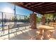 Community pickleball courts provide a fun recreational area under a covered space with picnic tables at 4637 E Narrowleaf Dr, Gilbert, AZ 85298