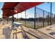 Well-maintained pickleball courts under a shaded canopy offer a fun and active recreational space at 4637 E Narrowleaf Dr, Gilbert, AZ 85298