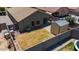 Aerial view of a home with a fire pit, solar panels and a shed at 5026 S 235Th Dr, Buckeye, AZ 85326