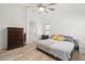 Spacious Primary bedroom featuring hardwood floors, neutral walls, and large windows at 5026 S 235Th Dr, Buckeye, AZ 85326