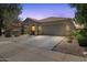 Attractive single-story home with a tile roof, neutral paint, and low maintenance landscaping at 5026 S 235Th Dr, Buckeye, AZ 85326