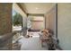 Welcoming covered front porch with seating, providing a cozy outdoor space at 5026 S 235Th Dr, Buckeye, AZ 85326