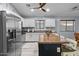 Modern kitchen with stainless steel appliances, a granite island, and white cabinetry at 5026 S 235Th Dr, Buckeye, AZ 85326