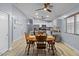 Bright eat-in kitchen features updated appliances, white cabinetry, and neutral walls at 5026 S 235Th Dr, Buckeye, AZ 85326