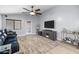 Open living room with neutral walls and tile floors boasts natural light and modern decor at 5026 S 235Th Dr, Buckeye, AZ 85326