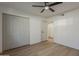 A bedroom with wood floor and closet at 5028 W Shangri La Rd, Glendale, AZ 85304
