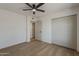 A bedroom with wood floor and a closet at 5028 W Shangri La Rd, Glendale, AZ 85304