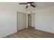 A bedroom with wood floor and closet at 5028 W Shangri La Rd, Glendale, AZ 85304