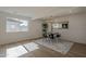 Bright dining room with modern table set, stylish light fixture and light colored wood flooring at 5028 W Shangri La Rd, Glendale, AZ 85304