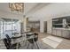 Dining room with open layout, access to the kitchen, and modern furnishings at 5028 W Shangri La Rd, Glendale, AZ 85304