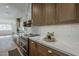 Bright kitchen featuring custom wood cabinetry, marble countertops, and stainless steel appliances at 5028 W Shangri La Rd, Glendale, AZ 85304