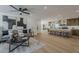 Open concept living room, dining area, and kitchen with modern decor and ample natural light at 5028 W Shangri La Rd, Glendale, AZ 85304