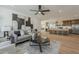 Open concept living room and kitchen featuring wood floors and modern decor at 5028 W Shangri La Rd, Glendale, AZ 85304