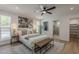Spacious main bedroom with a ceiling fan, walk-in closet, and en-suite bathroom at 5028 W Shangri La Rd, Glendale, AZ 85304
