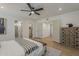 Main bedroom with access to the bathroom, large closet, and modern furnishings at 5028 W Shangri La Rd, Glendale, AZ 85304