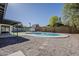 Backyard showcasing a refreshing pool and modern patio with desert landscaping, ideal for relaxation at 5028 W Shangri La Rd, Glendale, AZ 85304