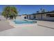 Sparkling pool with a sleek, light gray concrete surround, nestled in a private backyard oasis at 5028 W Shangri La Rd, Glendale, AZ 85304