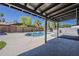 Inviting pool with a modern patio area, perfect for outdoor relaxation and entertaining with Arizona sunshine at 5028 W Shangri La Rd, Glendale, AZ 85304