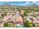 Scenic aerial perspective of well-maintained homes with solar panels, landscaping and mountain views at 5123 W Redbird Rd, Phoenix, AZ 85083