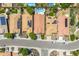 Aerial view of properties with green grass, pools, solar panels and mature landscaping in a residential area at 5123 W Redbird Rd, Phoenix, AZ 85083