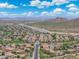 Gorgeous aerial view displaying a neighborhood alongside a canal and desert landscape at 5123 W Redbird Rd, Phoenix, AZ 85083