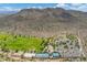 Expansive aerial view of a green sports field, park, and scenic mountain backdrop at 5123 W Redbird Rd, Phoenix, AZ 85083