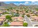 Expansive aerial view of a residential neighborhood with desert landscaping and mountain views on a sunny day at 5123 W Redbird Rd, Phoenix, AZ 85083
