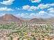 Stunning aerial view of a community with desert vegetation and mountains in the horizon at 5123 W Redbird Rd, Phoenix, AZ 85083