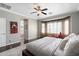Inviting bedroom featuring a bay window with natural light and comfortable seating area at 5123 W Redbird Rd, Phoenix, AZ 85083